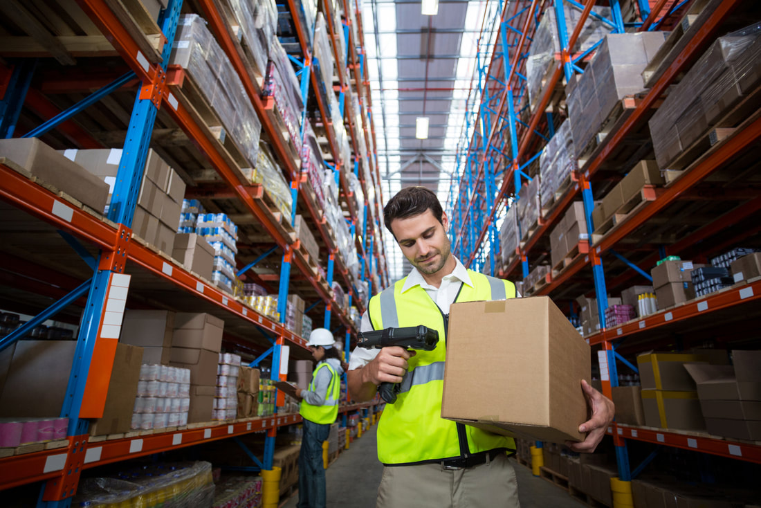 Warehouse worker scanning a box for an ecommerce order