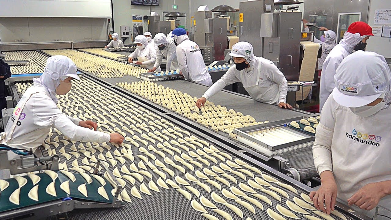 Workers on a food manufacturing production line