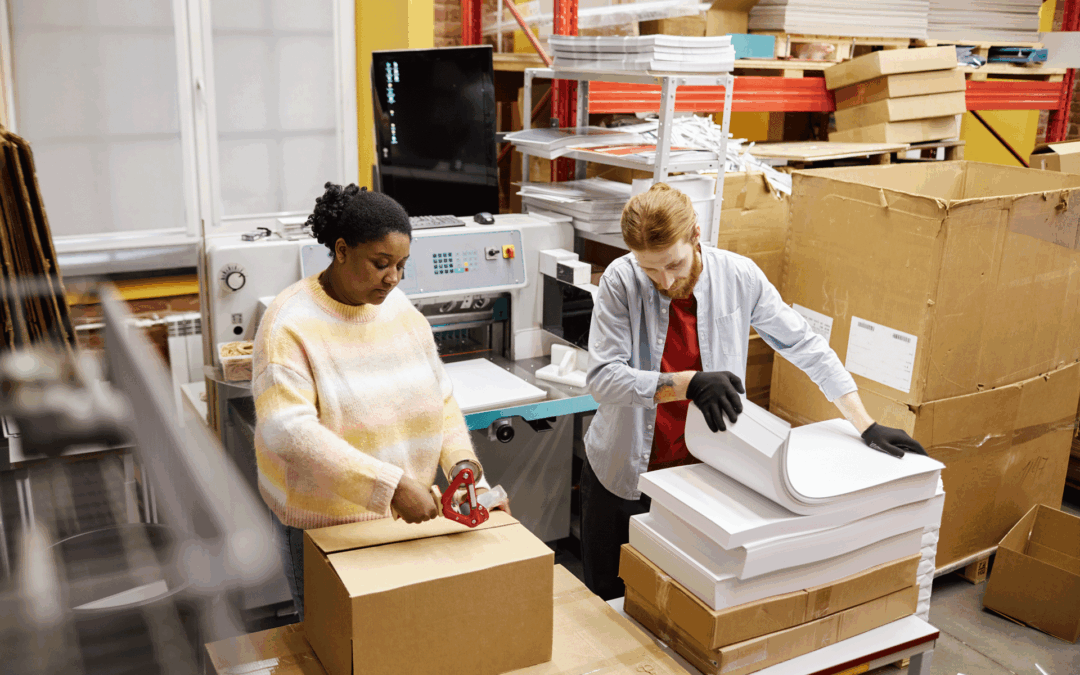Print fulfillment workers packing finished print jobs